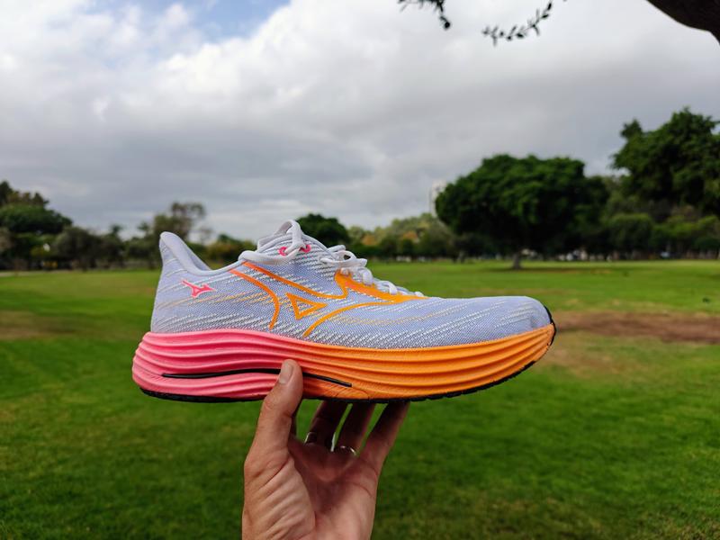 Beautiful photo of Mizuno Wave Rider 29 shoe on picturesque background