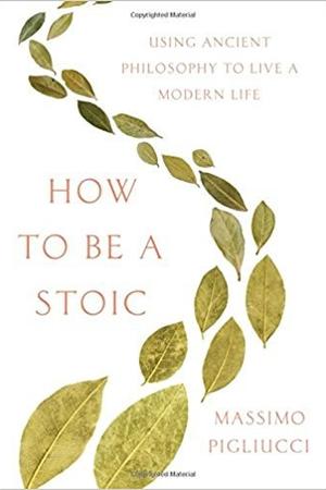 Book cover with a white background and a spiral of olive-branch leaves running diagonally from top to bottom. Black bold text reads: 'How to Be a Stoic' with the subtitle 'Using Ancient Philosophy to Live a Modern Life' at top and 'Massimo Pigliucci' at the bottom.